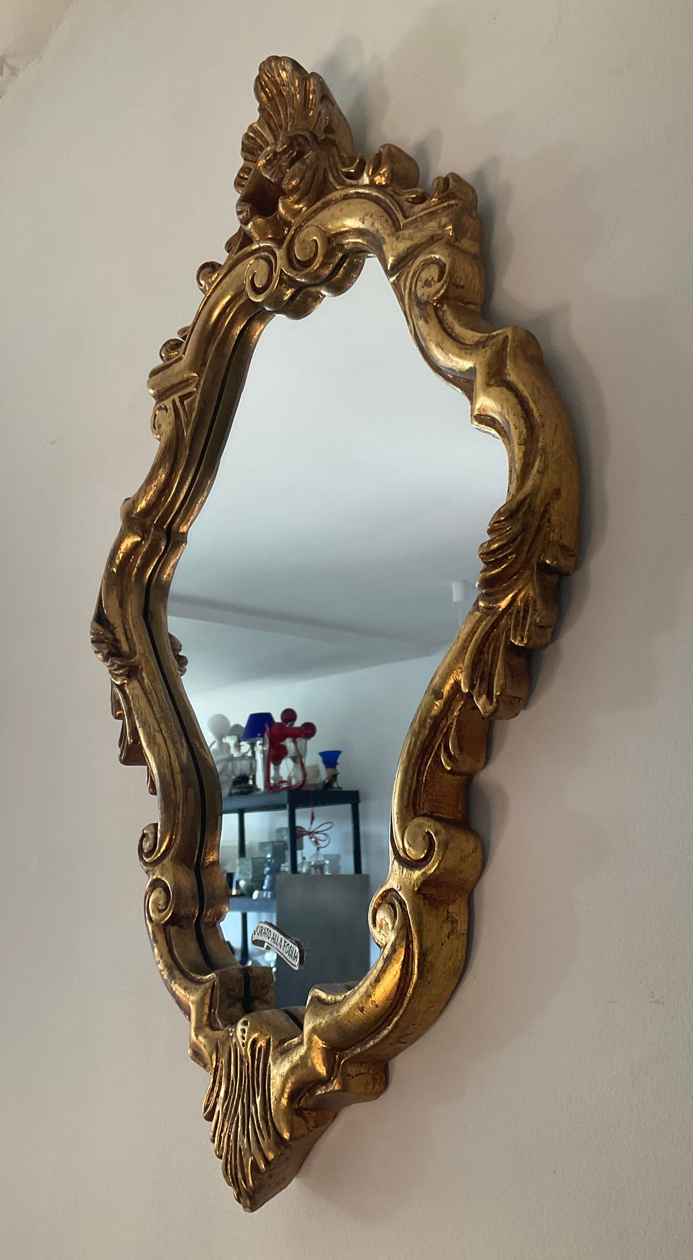 Old italian mirror in gilded plaster with leaf