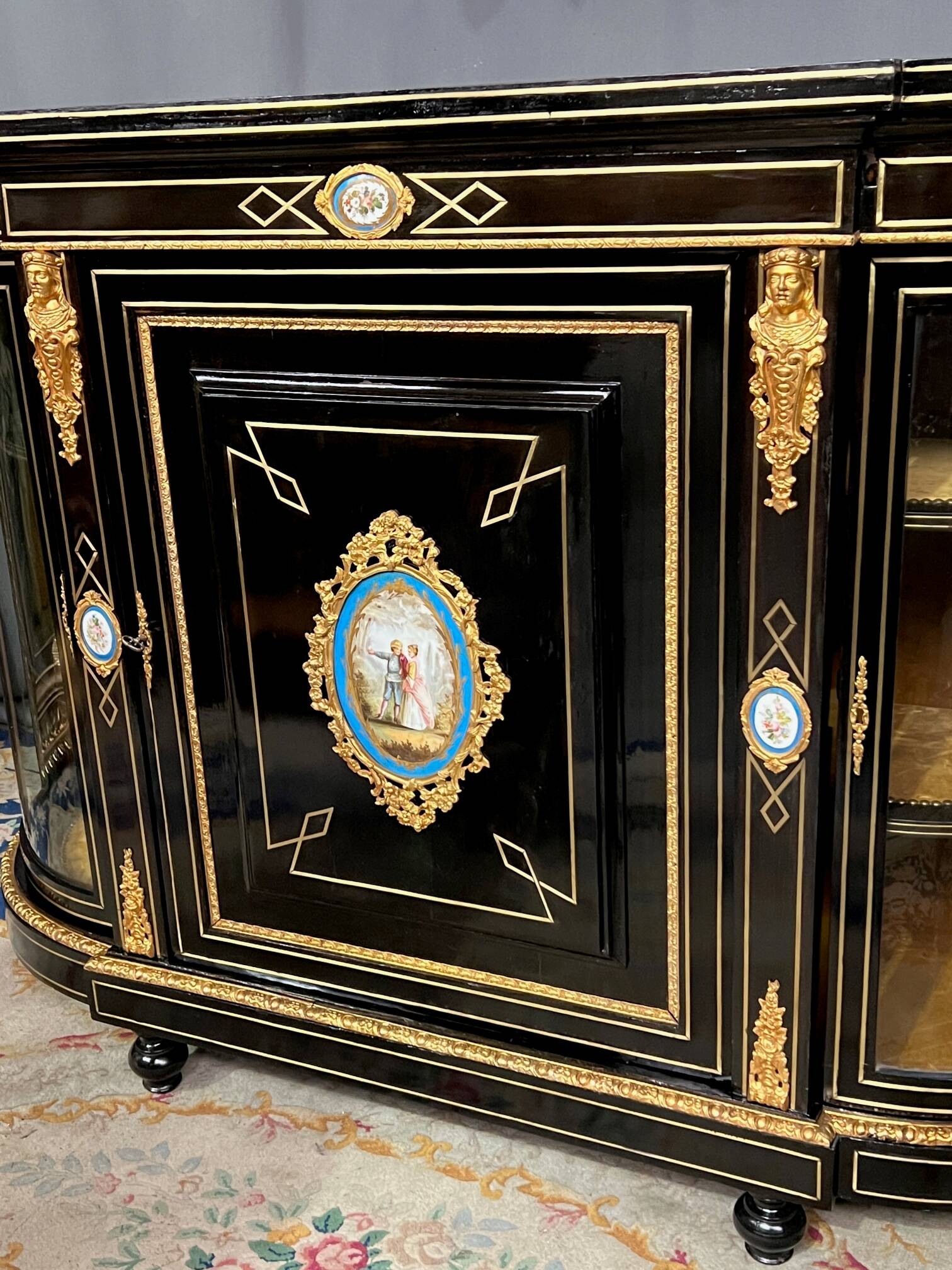 Napoleon III style credenza with four Sèvres medallions.
