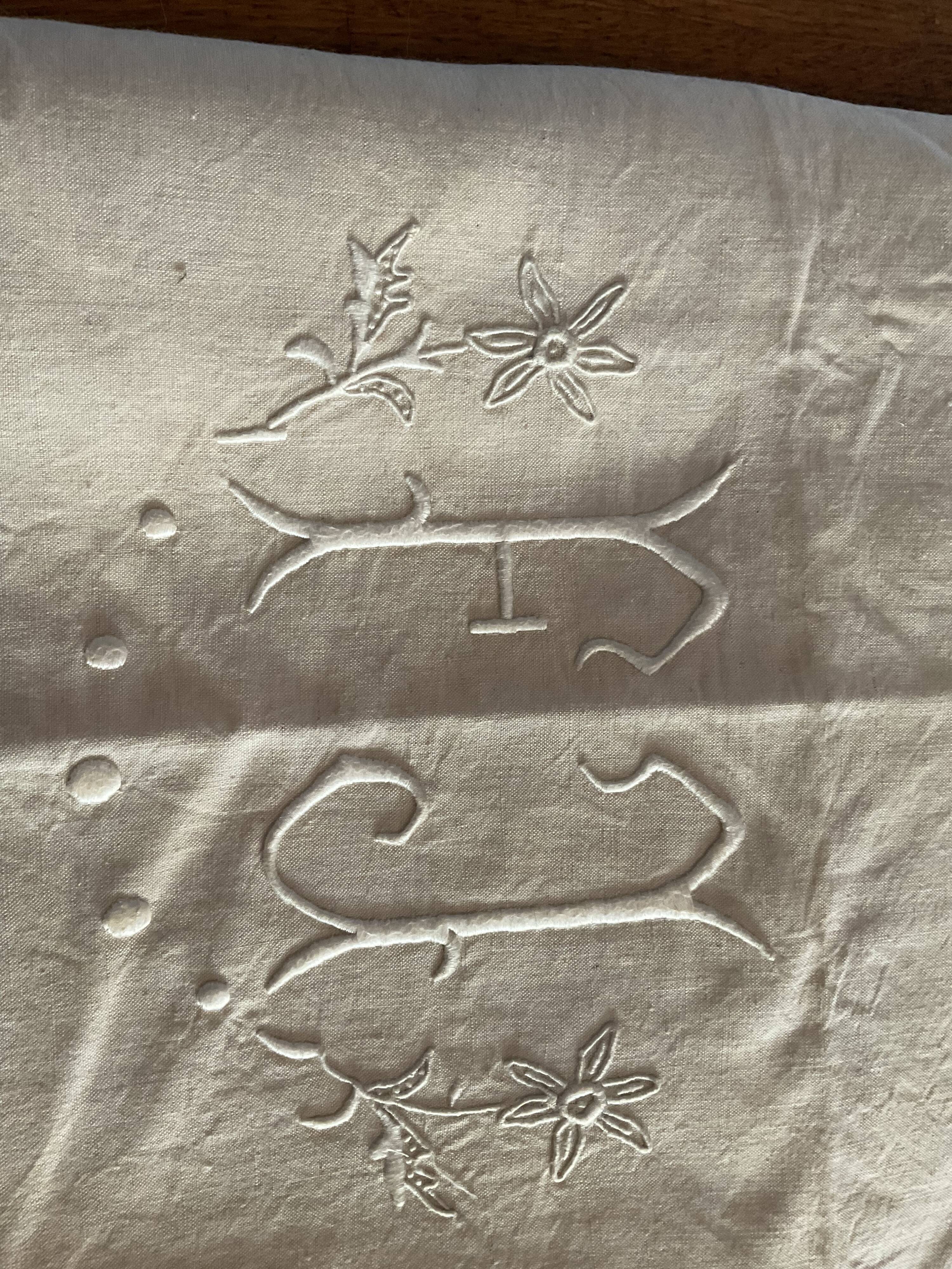Old embroidered sheet, monogram F J