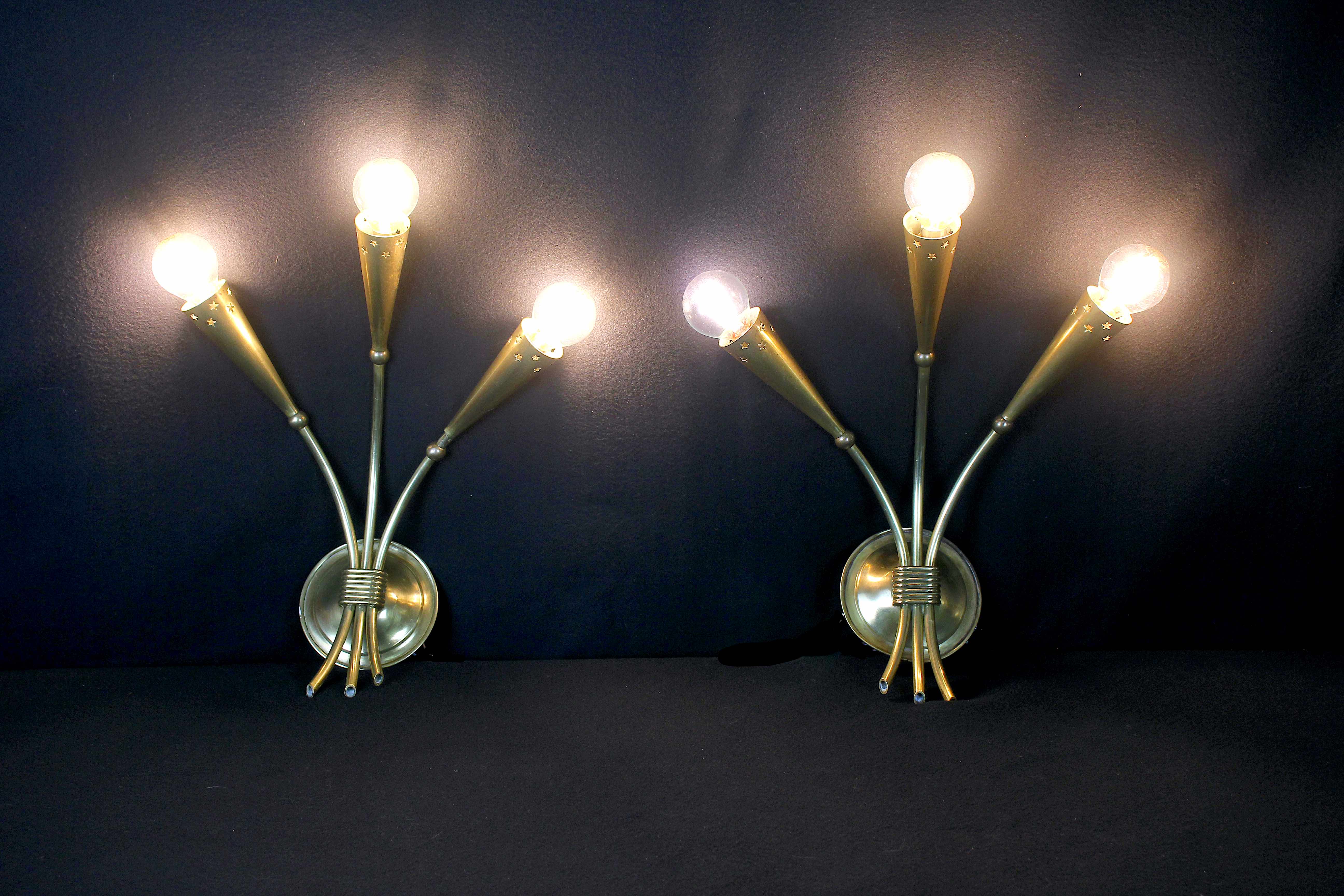 Three gilded brass sconces, Maison Lunel, France, 1950's