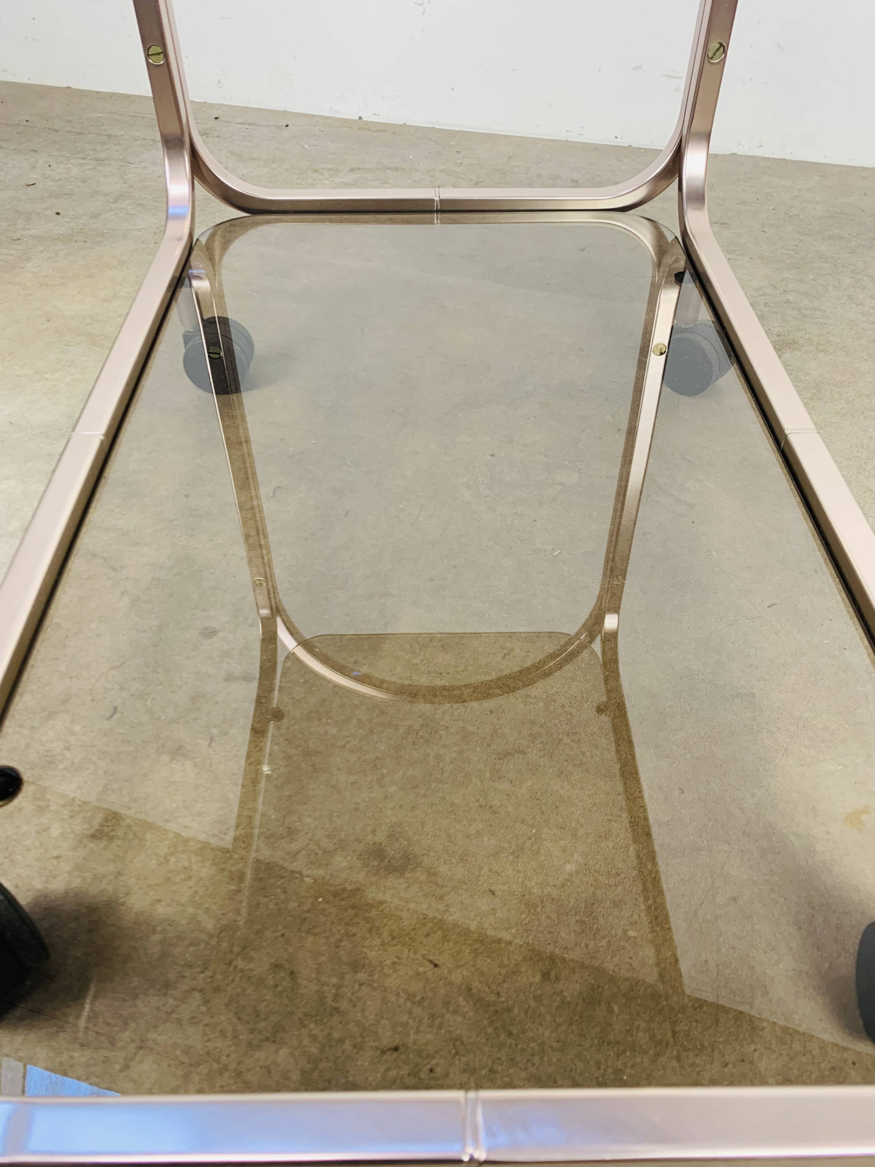 Kaymet dessert trolley in smoked glass and anodised aluminium, 1980s.