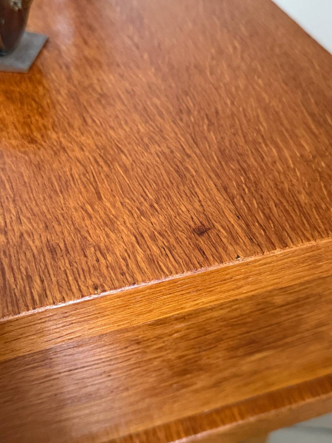 Vintage bedside table with tapered legs.