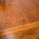 Vintage bedside table with tapered legs.
