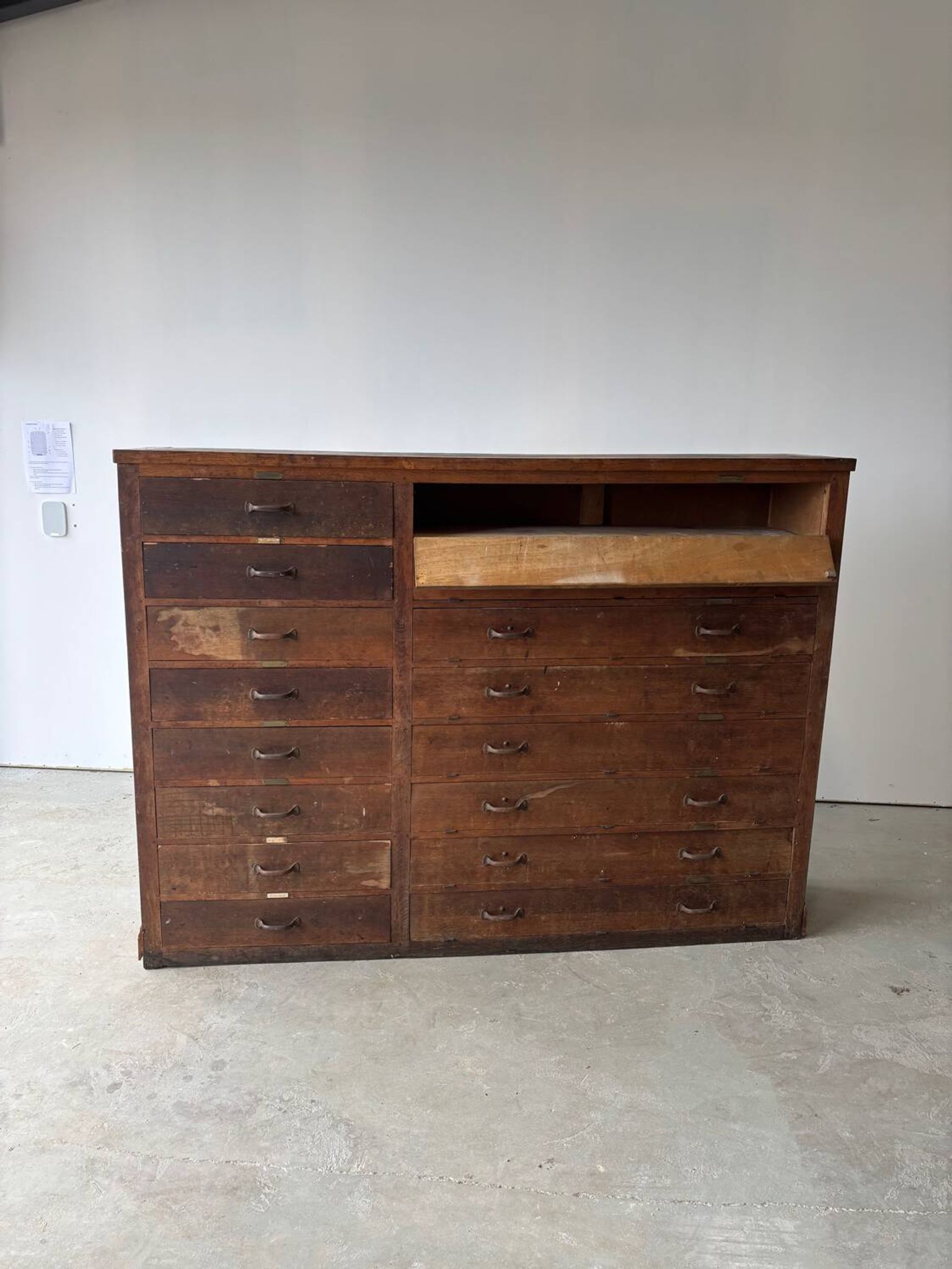 Large wooden workshop cabinet with 16 drawers, antique from the early 1900s.