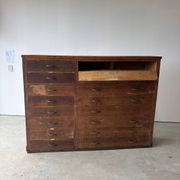 Large wooden workshop cabinet with 16 drawers, antique from the early 1900s.