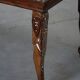 Vintage Indian teak coffee table inlaid with elephant motifs, mid-20th century.