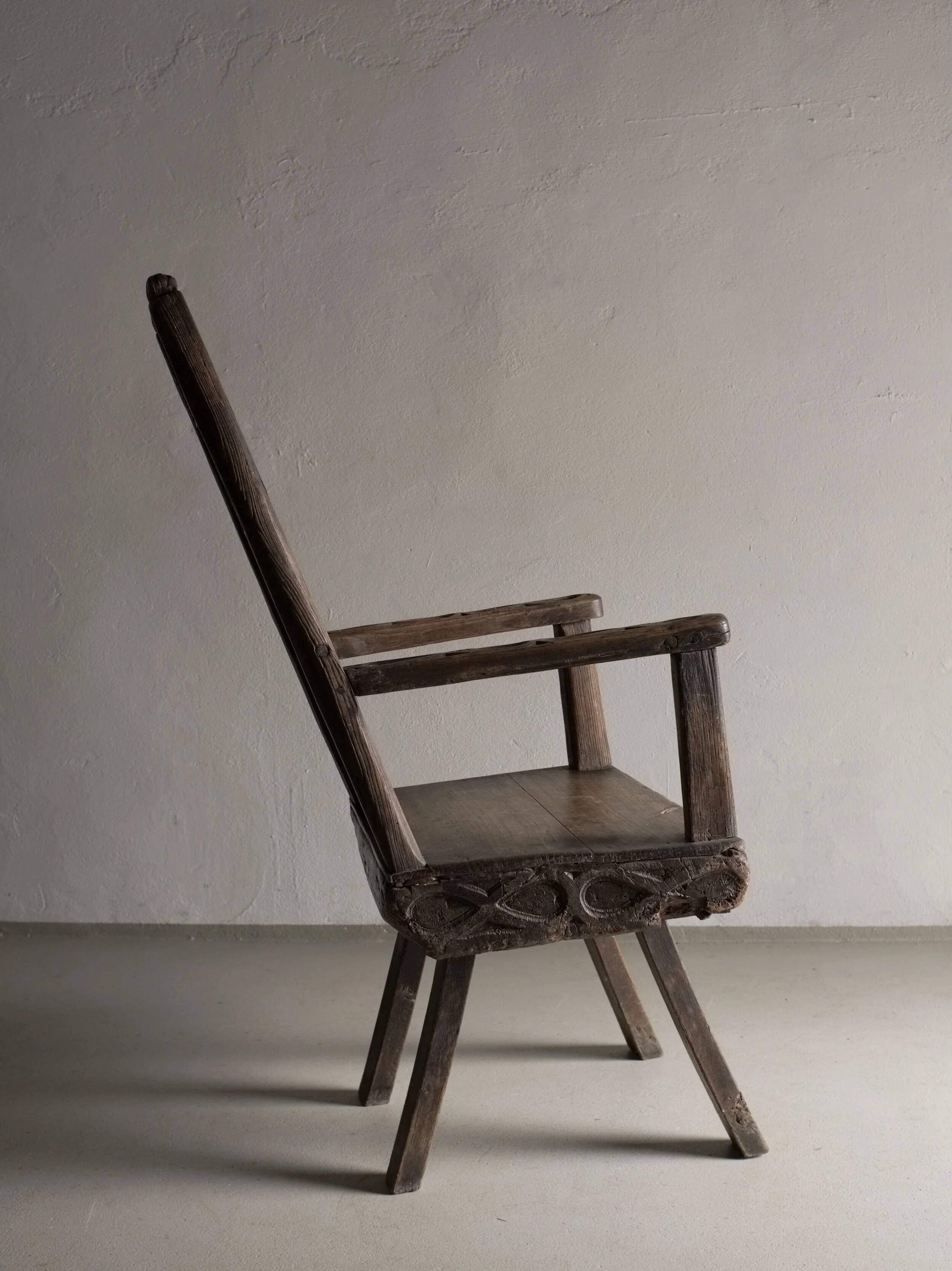 Antique primitive carved oak arm chair, Belgium