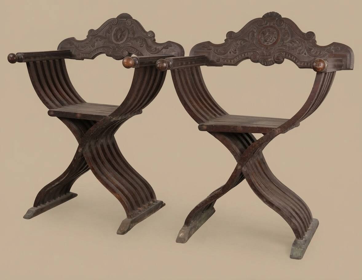 Pair of antique Savonarole armchairs in Renaissance style.