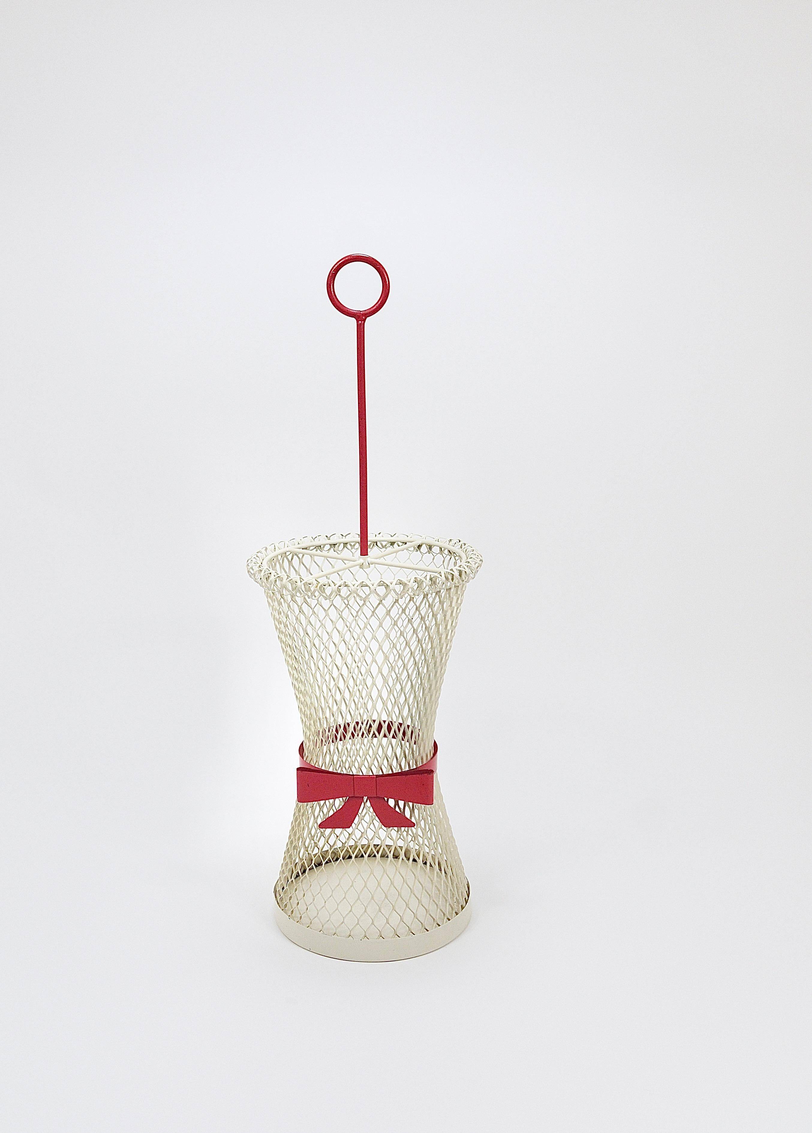 Bow tie umbrella stand in the style of Mathieu Matégot, mid-century, metal, France, 1950s.