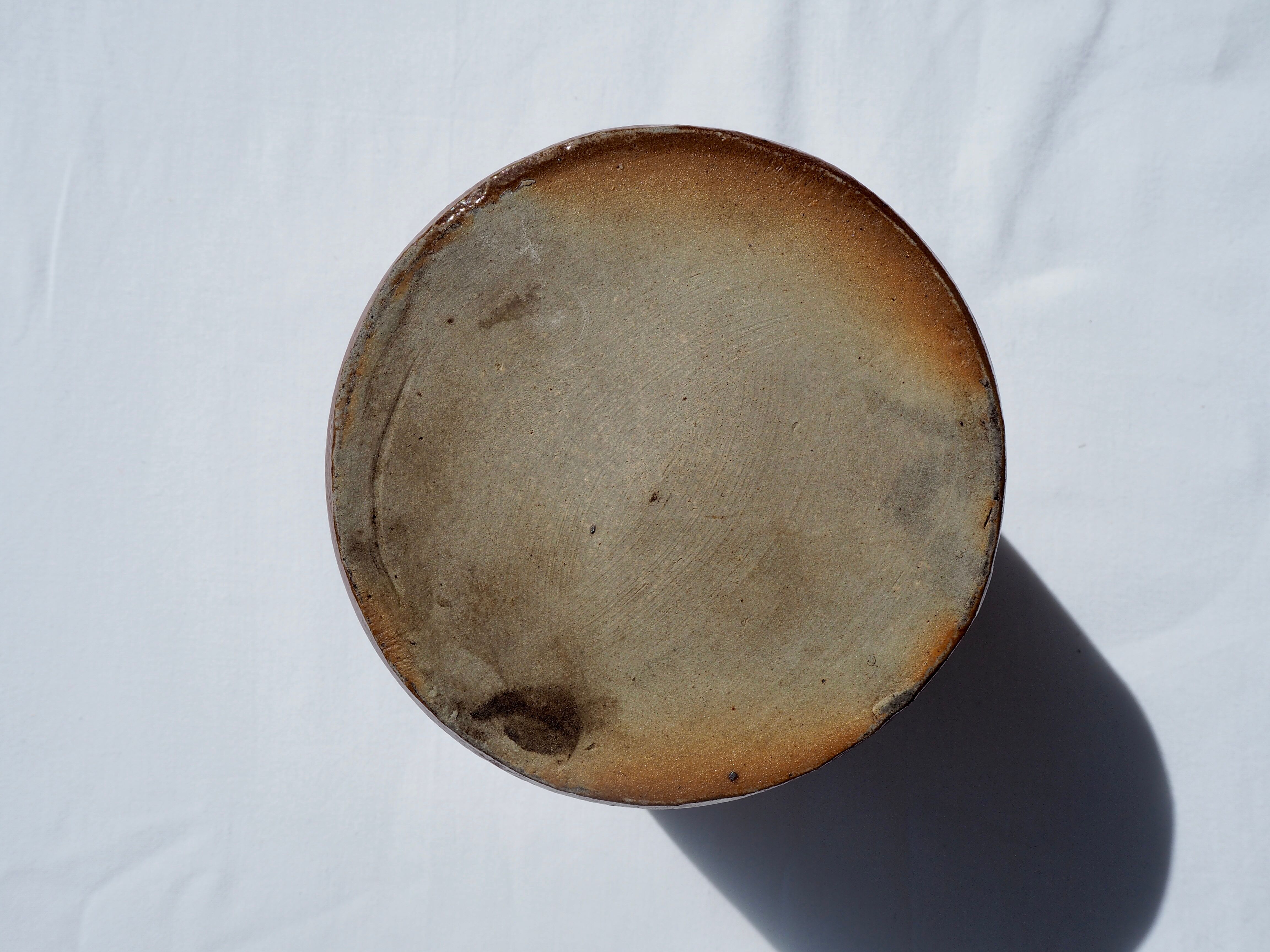 Trio of stoneware pots with lids
