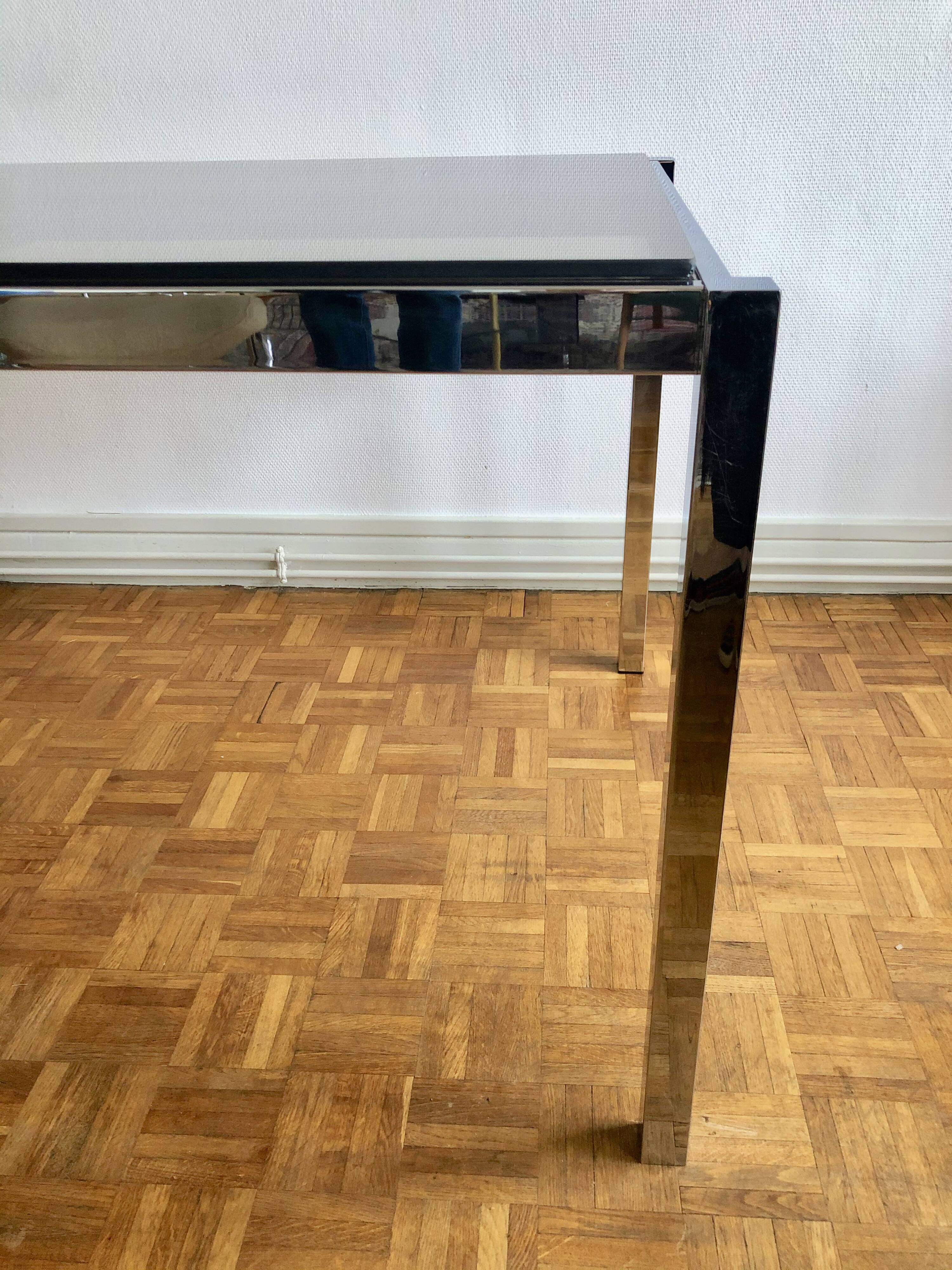 Glass and chrome metal dining table