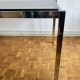 Glass and chrome metal dining table
