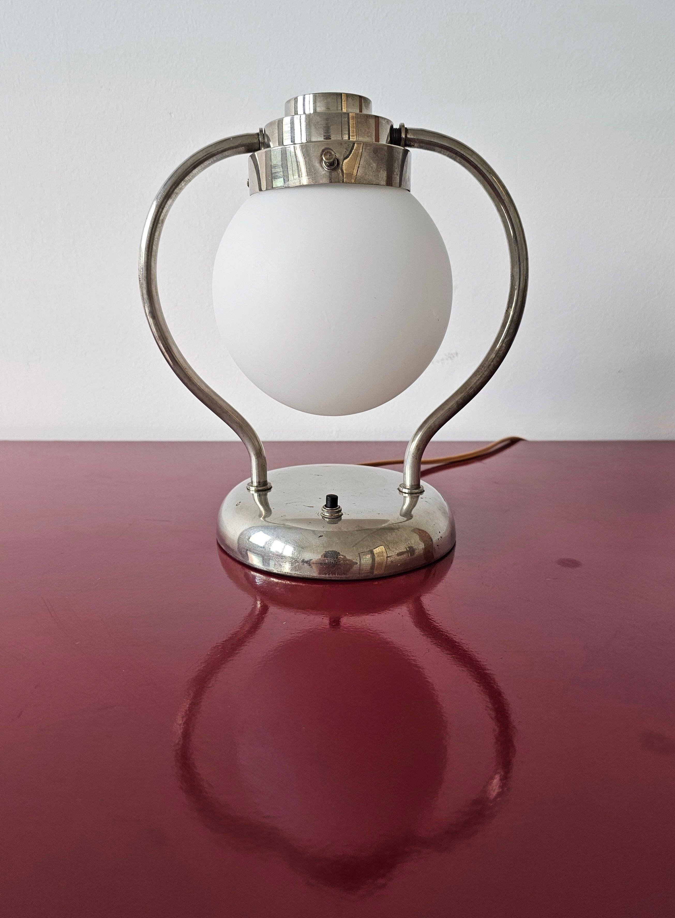 Art Deco table lamp with a spherical opaline glass shade and chrome base from the 1930s.