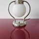 Art Deco table lamp with a spherical opaline glass shade and chrome base from the 1930s.