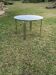 Mid-century round coffee table with chrome and silver glass top from the 1960s.