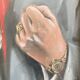 Painting clenched fist, signet ring and rolex
