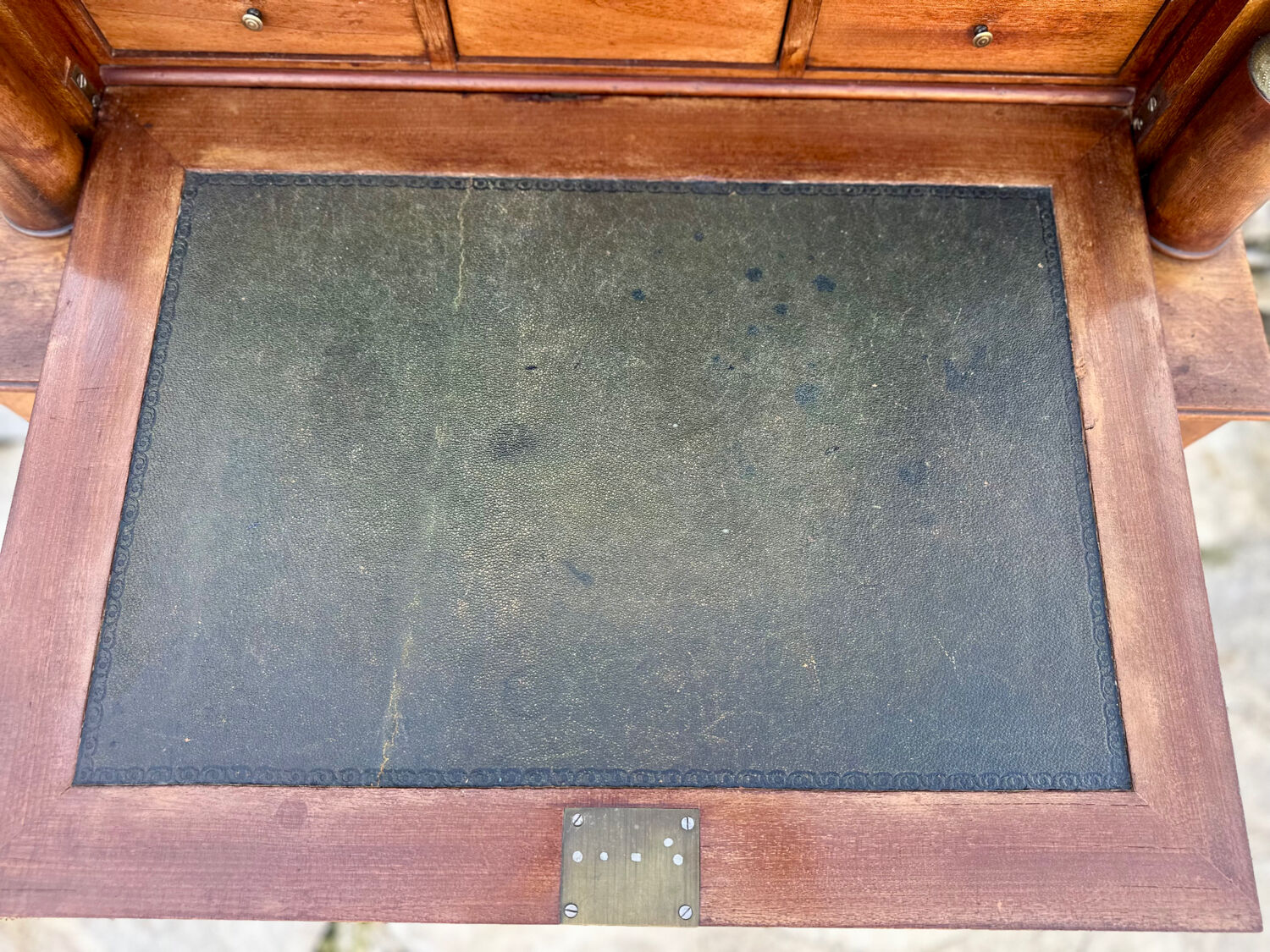 A small piece of Bonheur du jour with detached columns in Empire-era mahogany.