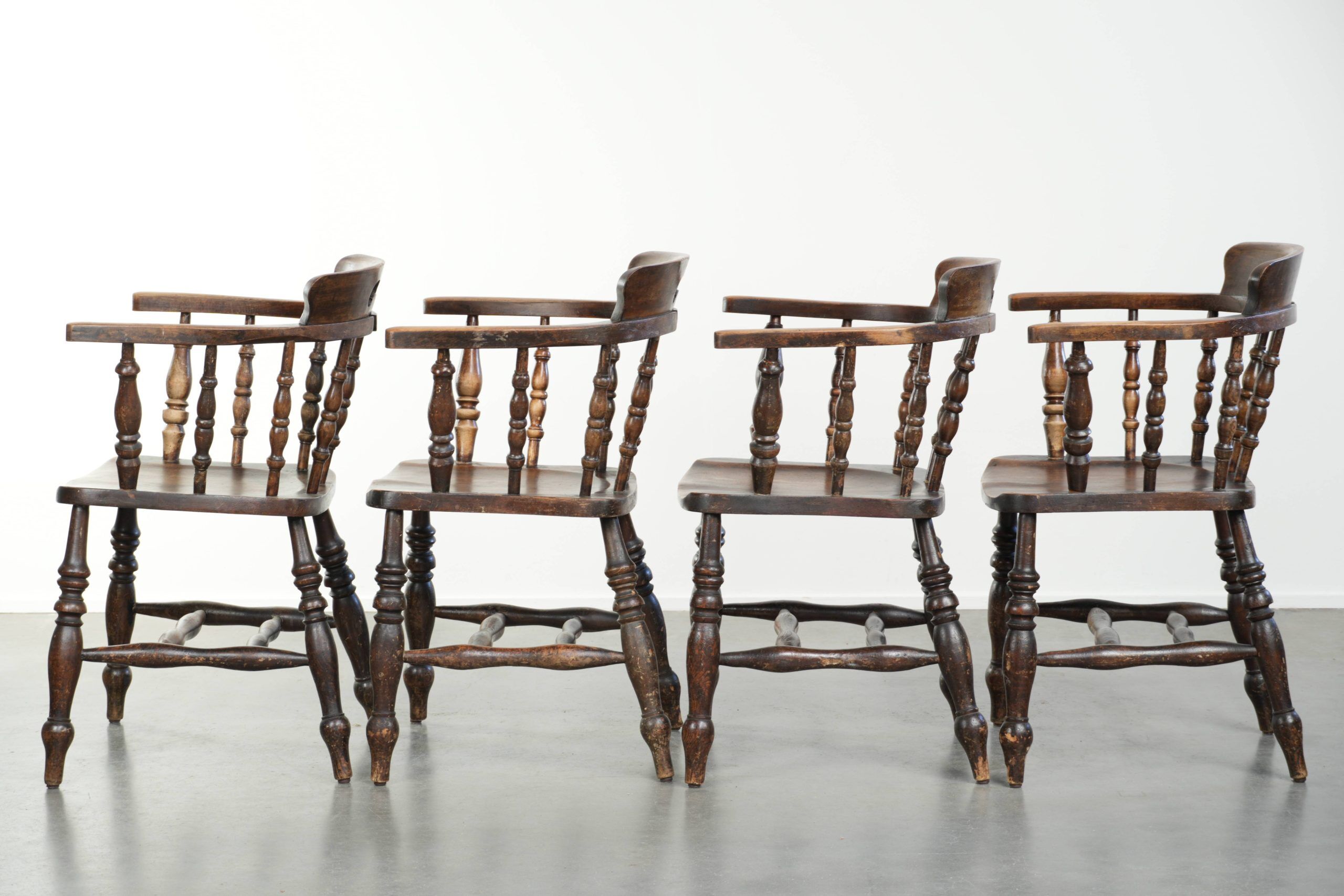 Set of four wooden English antique pub/captain chairs from the 19th century
