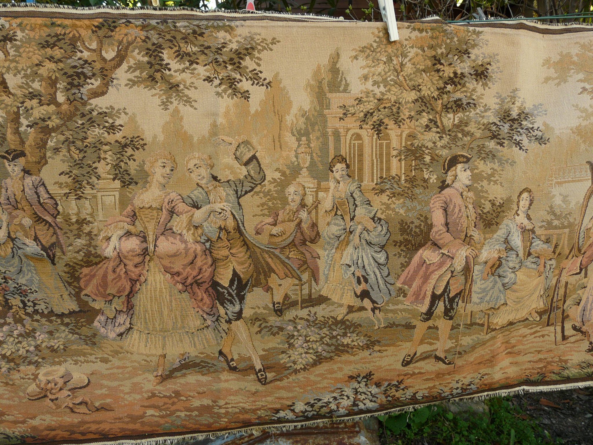 Tapestry wall hanging depicting a gallant scene from the mid-century.