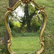 Beveled gilded wood mirror with violin shapes, Louis XV baroque style shell