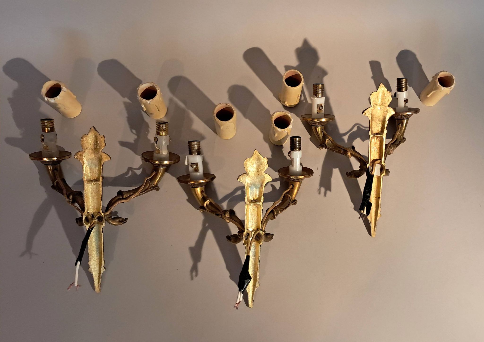 Set of 3 Empire style wall lights in bronze and gilded and green lacquered brass, Circa 1950.