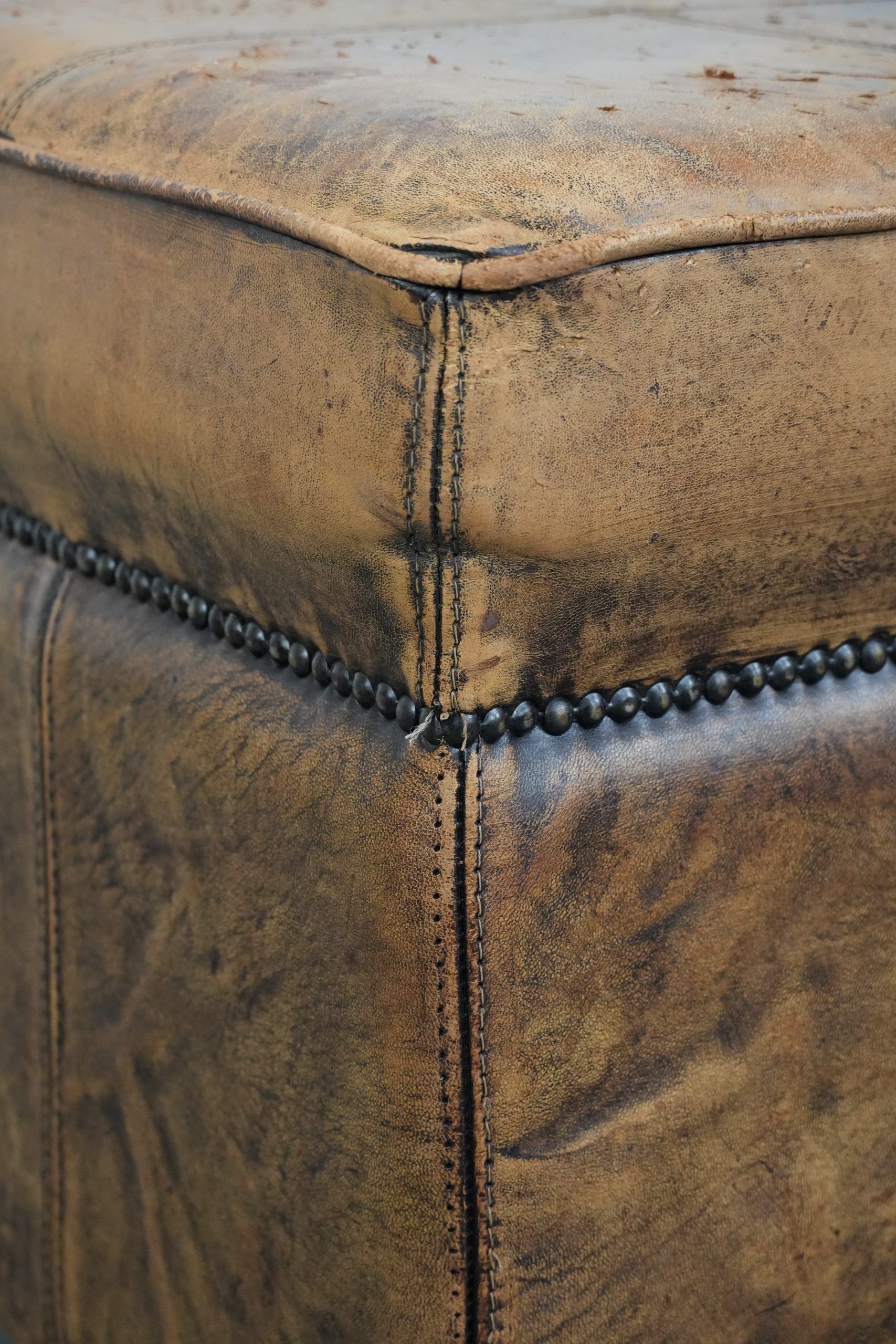 Sturdy square vintage sheepskin pouf/ottoman with beautiful colours