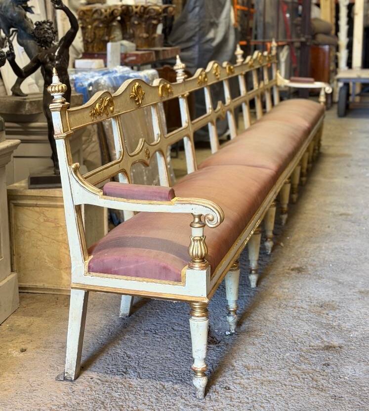 Carved wooden bench, gilded and painted, Italy around 1880, 510cm long.