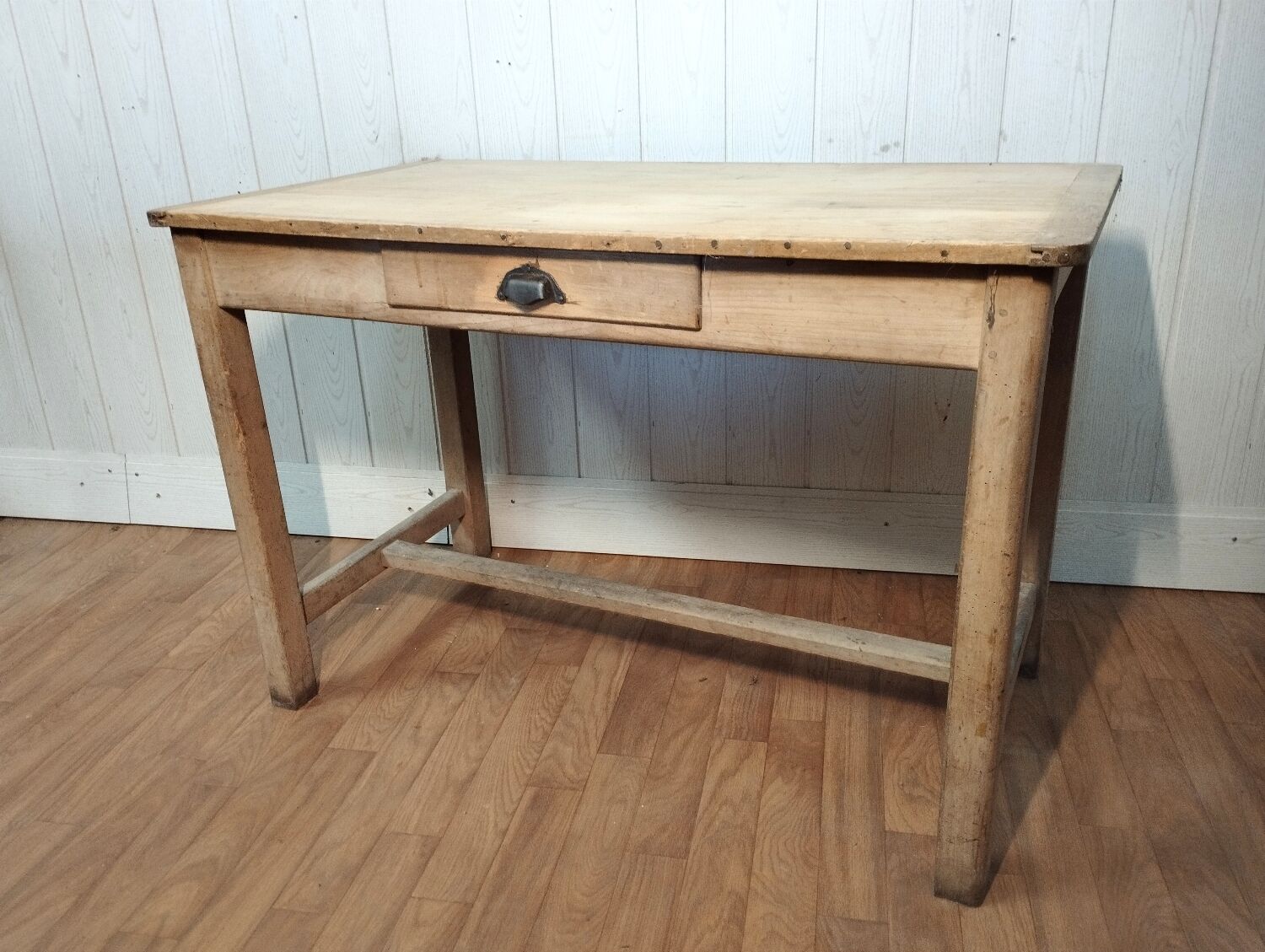 Antique farmhouse table in raw wood