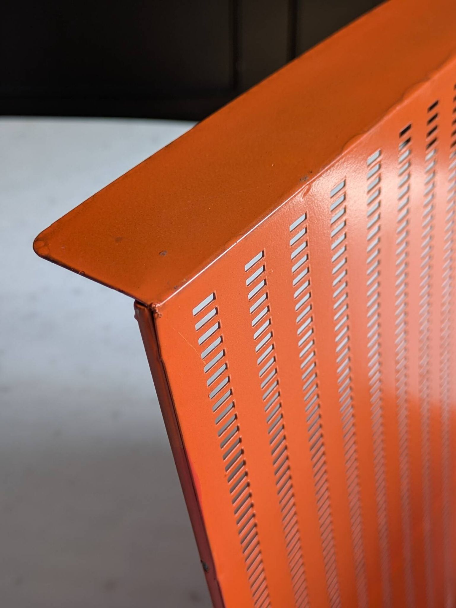 Vintage metal magazine rack in perforated orange/Mathieu Mategot style/70s