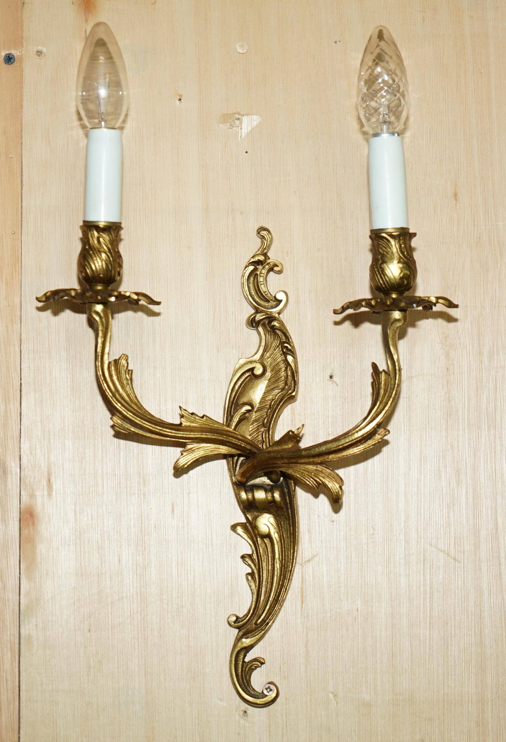 Pair of antique French wall sconces, gilded and bronzed, from the 1920s.