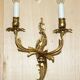 Pair of antique French wall sconces, gilded and bronzed, from the 1920s.