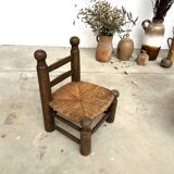 Brutalist chair in wood and straw