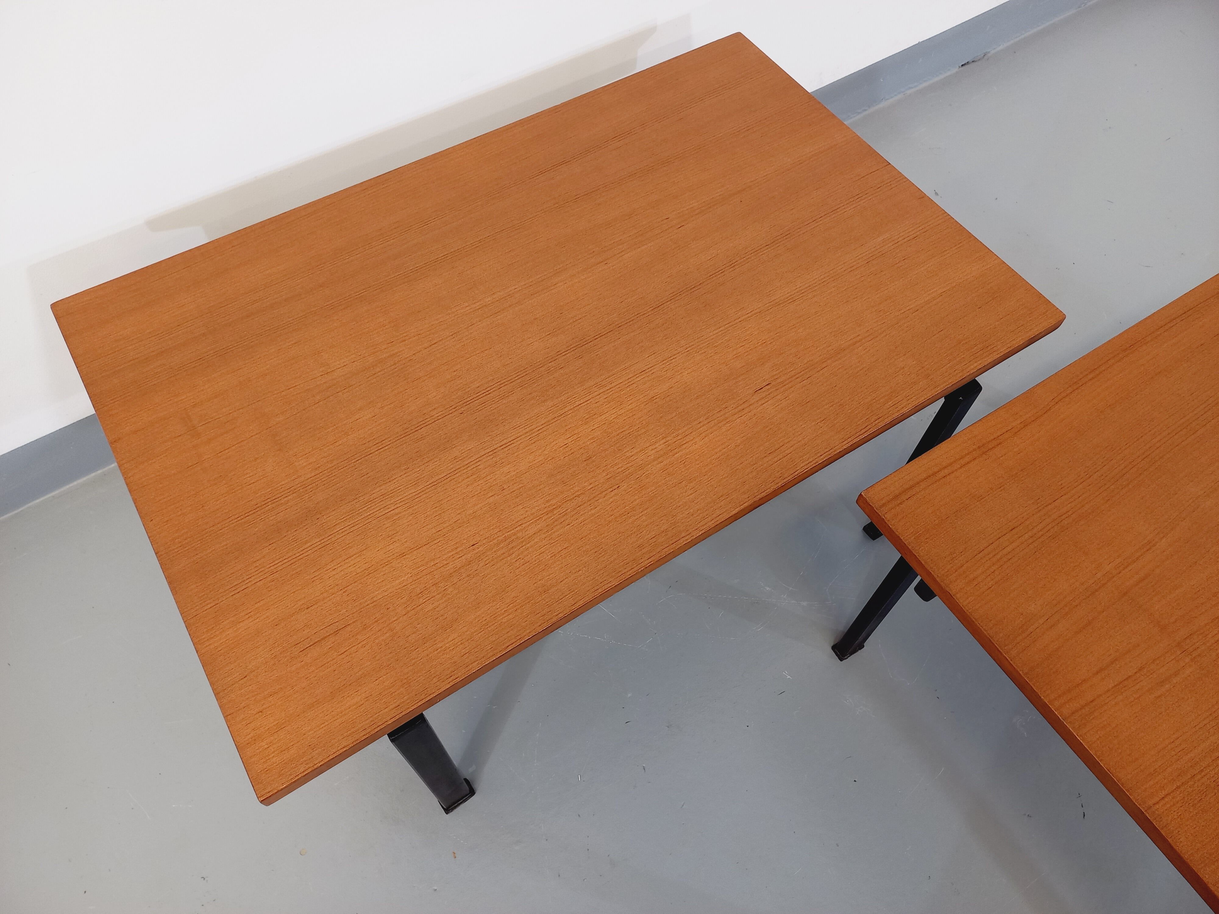 Suite of two vintage modernist Isa coffee tables in teak and black metal from the 60s