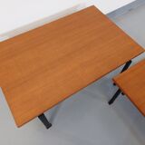 Suite of two vintage modernist Isa coffee tables in teak and black metal from the 60s