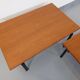 Suite of two vintage modernist Isa coffee tables in teak and black metal from the 60s
