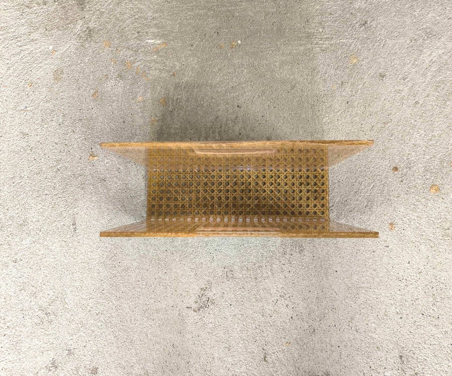 Vintage magazine rack in plexiglass and cane.
