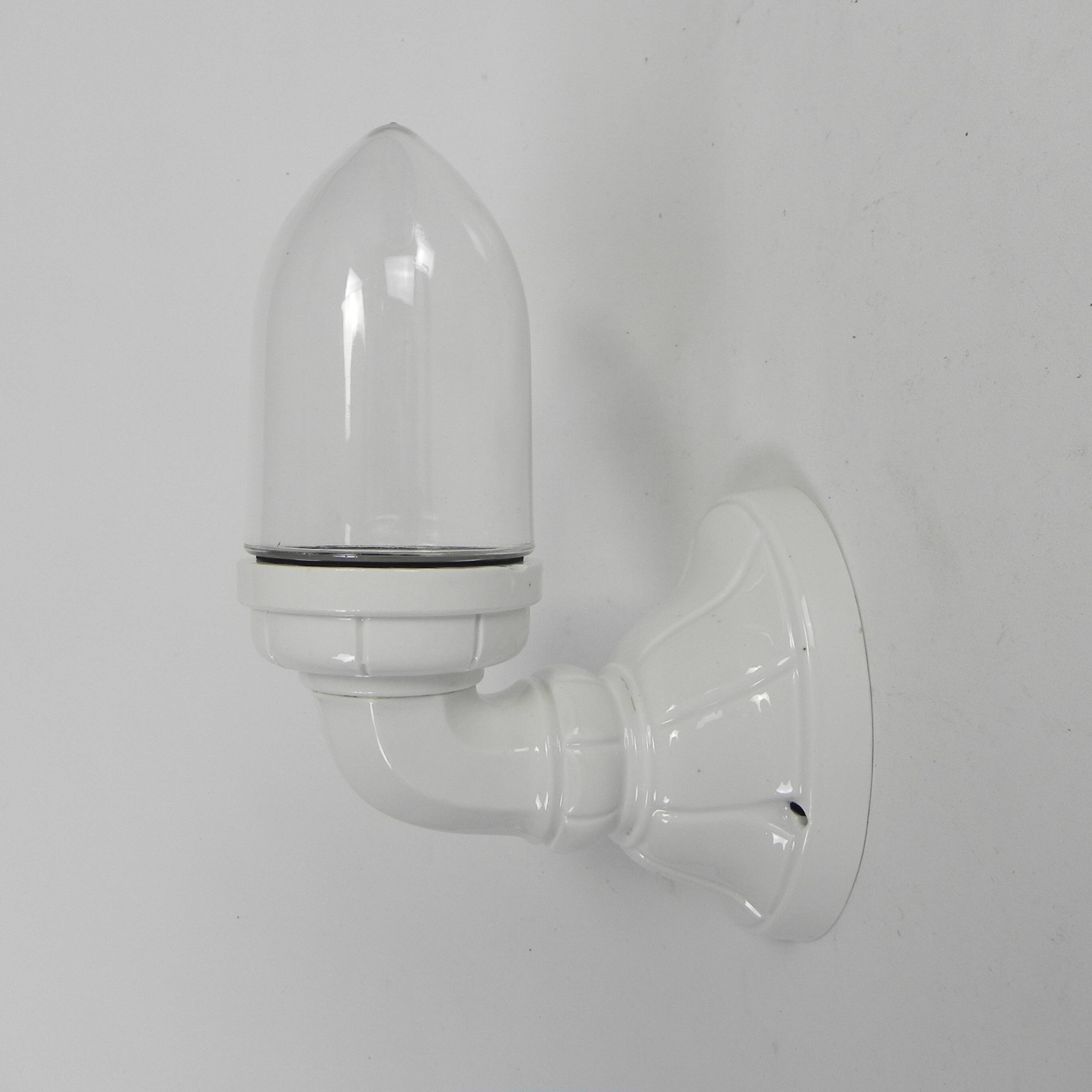 Wall lamp in porcelain with a transparent glass shade, 1930s.