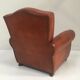 Large club chair in cognac leather