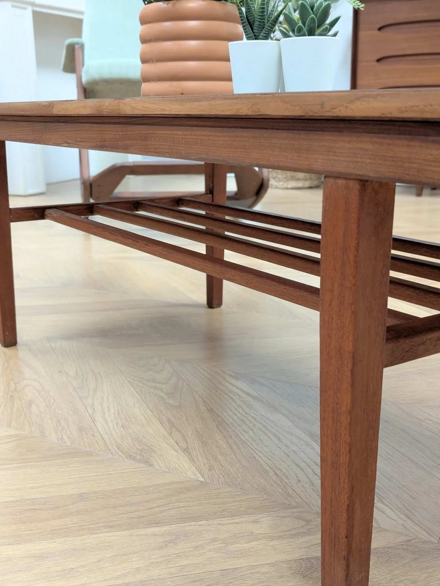 Vintage Danish coffee table in teak with a black top from the 1960s.