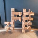 Articulated vertical wall coat rack