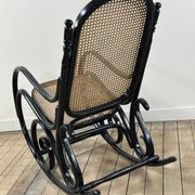 Rocking chair in blackened curved wood and cane, 1900s