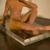 Terracotta sculpture of a seated woman by Norbert Treca contemporary art.