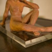Terracotta sculpture of a seated woman by Norbert Treca contemporary art.
