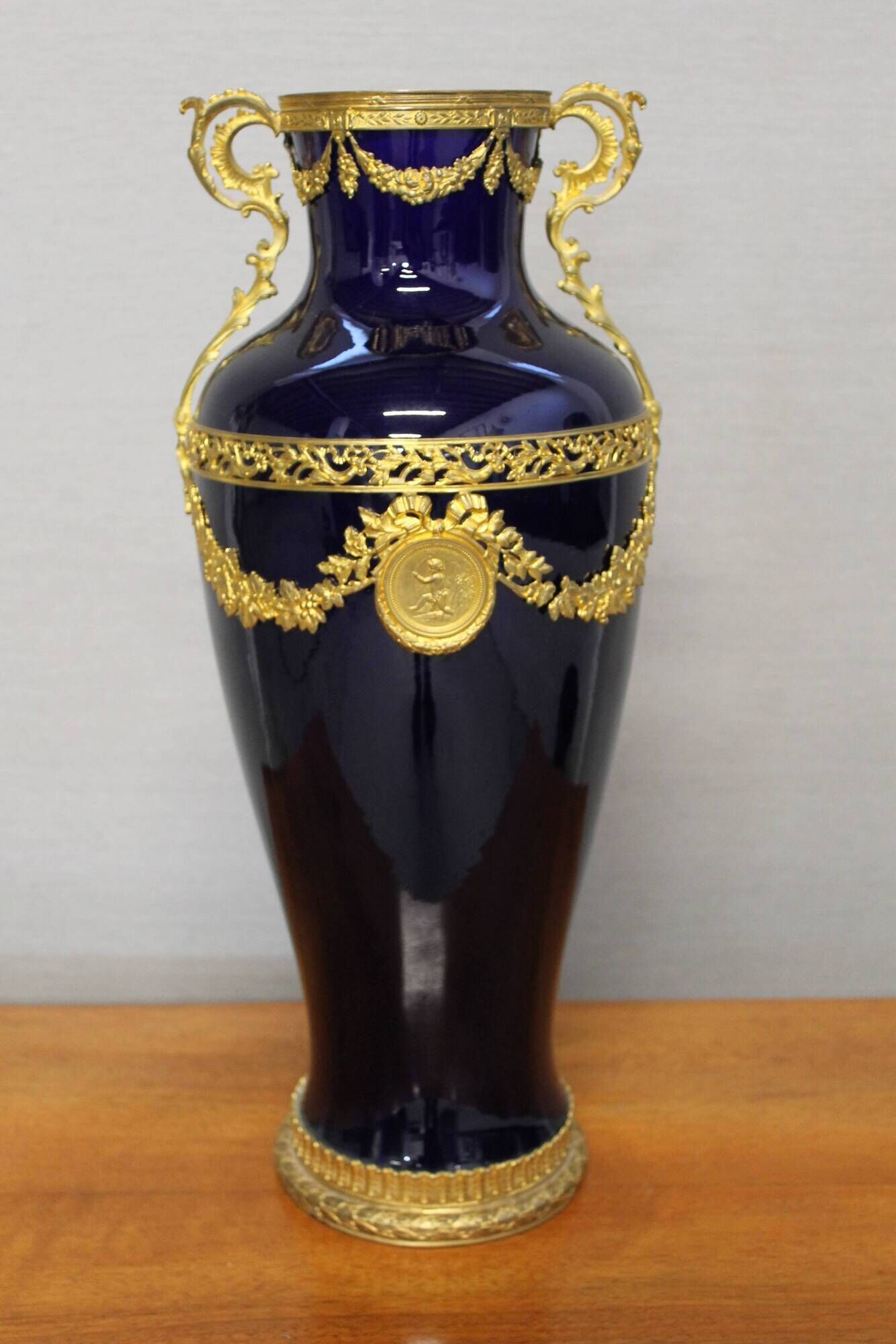 Vase signed Legastelois in blue ceramic of Sèvres and gilded bronze