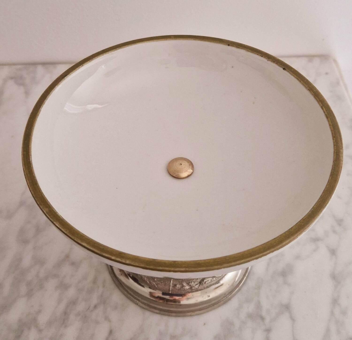 Porcelain cup on silver metal foot