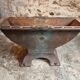 Old French industrial table with a cast iron base and a pine top.