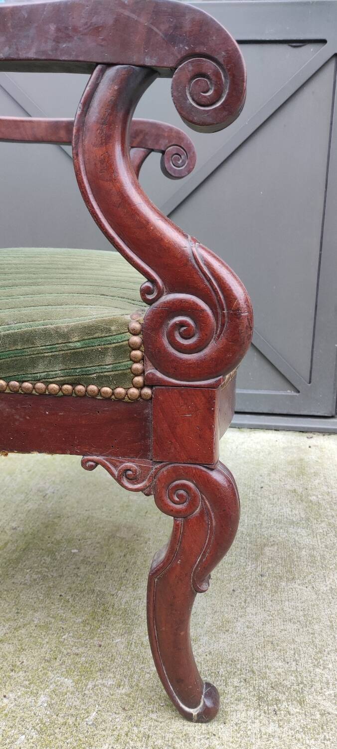 Old green velvet armchair