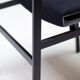 Set of four entirely black Hulmefa dining chairs, Architectural Modernism.