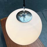 Minimalist suspended glass ball lamp from the vintage German space age by Glashütte Limburg, 1970s.
