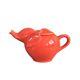 Large coral-coloured elephant teapot.